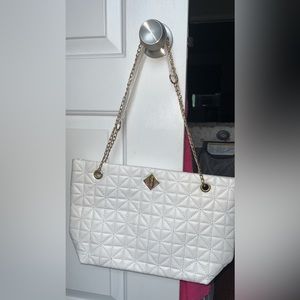 White purse with gold chain strap